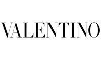 <p>Valentino is the first high fashion and prêt-à-porter line by Valentino Garavani, who opens his first atelier in via Condotti in Rome in 1959.</p>

<p>The Italian designer initially collaborates with Jean Dessès and Guy Laroche and in the 60s he became a fashion king, consecrated on the pages of Vogue.</p>

<p>In the '70s, after having chosen the "V" as the logo of its brand, it became synonymous with high class and tailoring.</p>

<p>Over the years Valentino, master of high fashion, presents collections of elitist evening dresses and great galà with impeccable cuts and luxury accessories for men and women.</p>

<p>The feminine dresses emphasize the hips and reveal the décolleté, enriched with jewels and romantic touches.</p>

<p>In 1967, he was awarded two honors in America: the Neiman Marcus Award in Dallas, equivalent to the Oscar for Fashion, and the Palm Beach Award for Palm Beach. Moreover, in the same year he presented the first Valentino Uomo collection.</p>

<p>In 2005 he was awarded the Légion d'honneur, the highest honor awarded by the French Republic, which is rarely granted to non-French personalities.</p>

<p>After 45 years of work, in 2007, he leaves the fashion house, giving way to the designer Alessandra Facchinetti, who in turn passed the scepter to the current creative directors of the brand, Maria Grazia Chiuri and Pier Paolo Piccioli.</p>

<p>Finally, on 12 July 2012, the fashion house was sold to the Mayhoola for Investments company in Qatar.</p>
